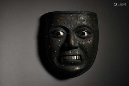 A BRONZE MASK