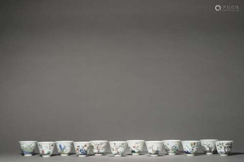 A SET OF 12 QING KANGXI PERIOD GODS CUPS