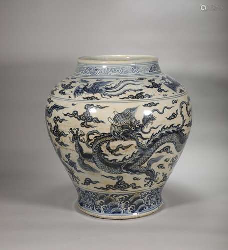 A Ming Dynasty blank period blue and white dragon pot