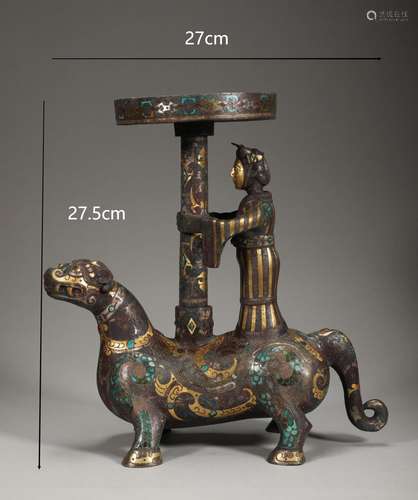 An ancient bronze inlaid gold and silver beast lamp