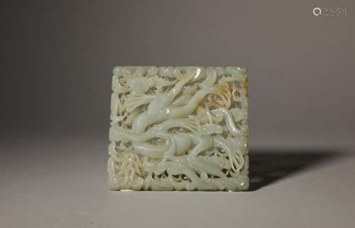 A Ming Dynasty carved jade belt plate with dragon pattern