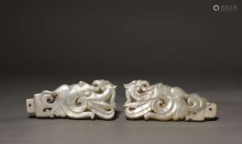 A pair of Ming Dynasty carved jade plates with phoenix patte...