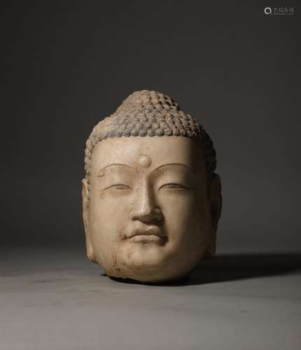 An old white stone Buddha head before the Ming Dynasty