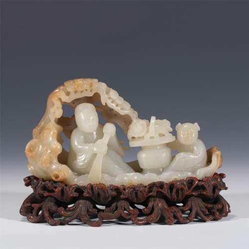 A JADE CARVED FIGURE ON BOAT