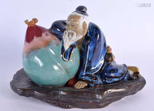 A CHINESE REPUBLICAN PERIOD POTTERY FIGURE OF A MALE enamell...