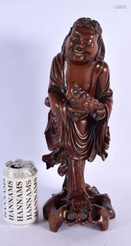 A LARGE 19TH CENTURY CHINESE CARVED ROOTWOOD FIGURE OF AN IM...