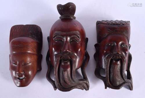 THREE LATE 19TH CENTURY JAPANESE CARVED HARDWOOD MASKS. Larg...