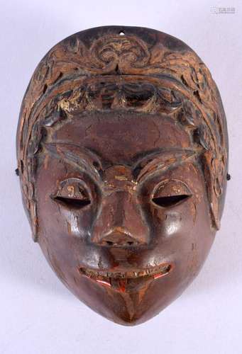 A 19TH CENTURY JAVANESE CARVED POLYCHROMED WOOD MASK. 21 cm ...