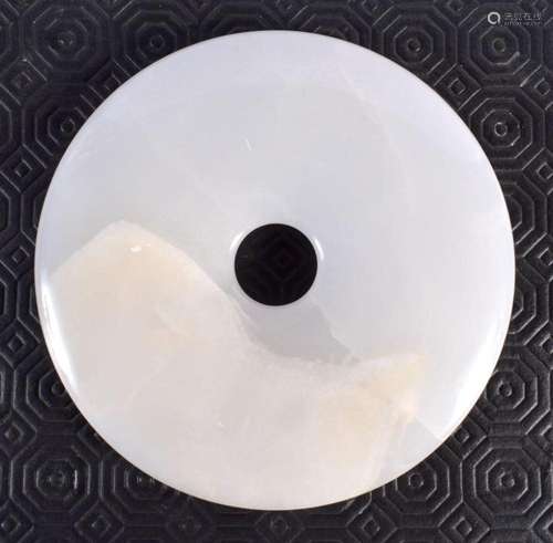 A CHINESE JADE TYPE BI DISC 20th Century. 15 cm diameter.