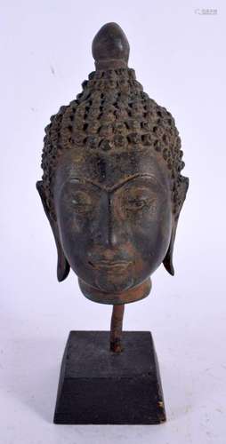 A 17TH/18TH CENTURY THAI BRONZE BUDDHA HEAD upon a later bas...