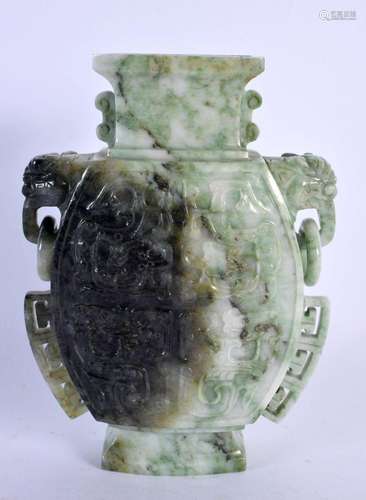 AN EARLY 20TH CENTURY CHINESE TWIN HANDLED JADEITE VASE Late...