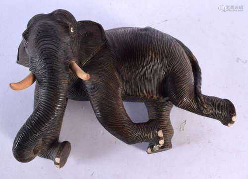 A 19TH CENTURY INDIAN CARVED HARDWOOD FIGURE OF AN ELEPHANT ...