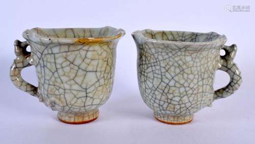 A VERY RARE PAIR OF EARLY CHINESE GUAN-TYPE STONEWARE WINE C...