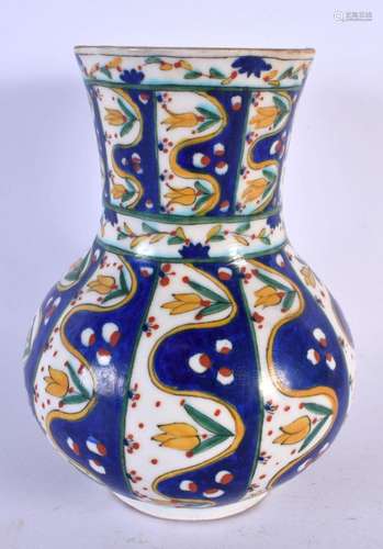 A TURKISH KUTAHYA POTTERY VASE painted with flowers. 21 cm x...