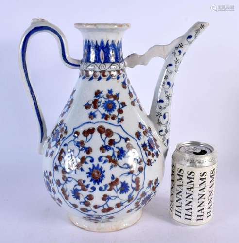 A LARGE TURKISH BLUE AND WHITE IRON RED PAINTED EWER painted...