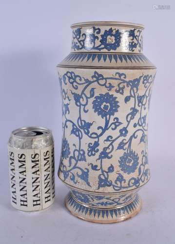 A MIDDLE EASTERN ISLAMIC ALBARELLO JAR painted with flowers....