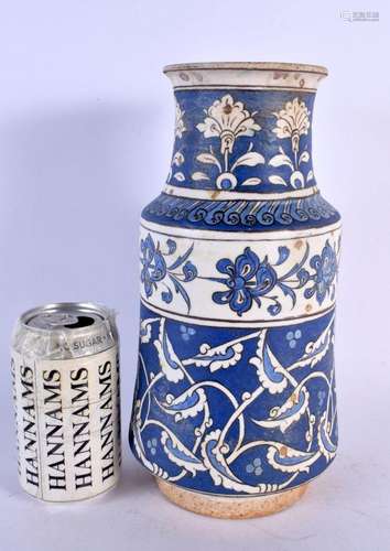 A TURKISH IZNIK ALBARELLO VASE painted with stylised foliage...