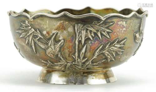 Chinese export silver footed bowl decorated in relief with b...