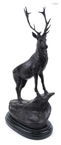 Large patinated bronze stag raised on a black marble base, 7...