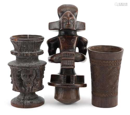 African tribal interest wood carvings including a beaker wit...