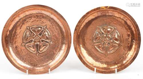 Manner of Newlyn, pair of Arts & Crafts planished copper...