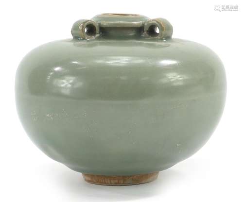 Chinese porcelain three handled jar having a celadon glaze, ...