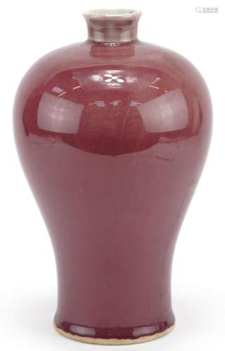 Chinese porcelain baluster vase having a sang de boeuf glaze...