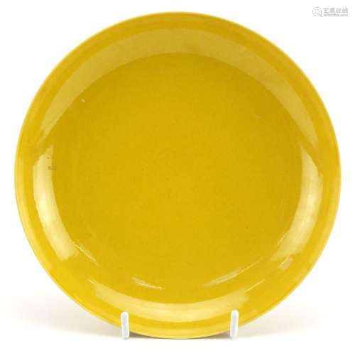 Chinese porcelain shallow footed plate having a yellow glaze...