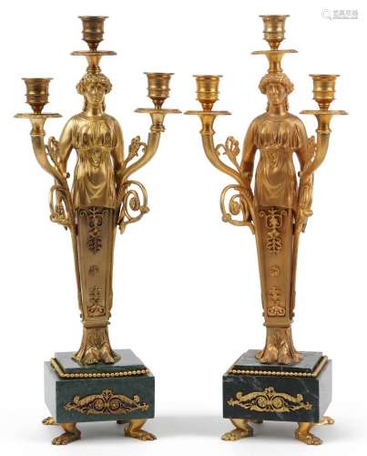 Pair of French Empire style ormolu three branch figural cand...