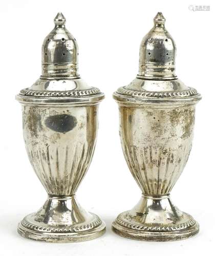 Pair of sterling silver casters, 12cm high, total weight 268...