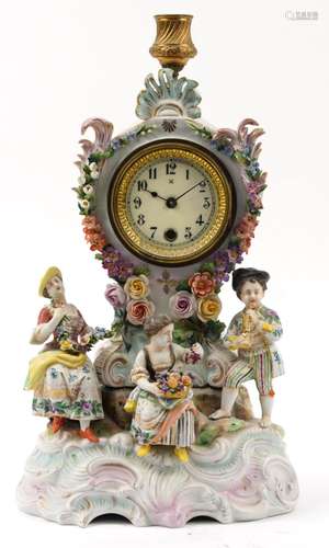 German porcelain floral encrusted mantle clock with candleho...