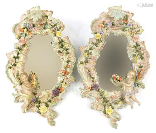 Pair of German floral encrusted porcelain cartouche wall mir...