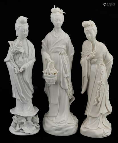 Three Chinese porcelain figures of Guanyin, each having a bl...