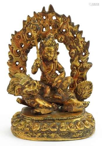 Chino Tibetan gilt bronze deity on mythical animal, 17cm hig...