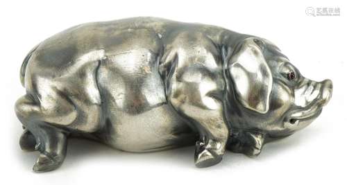 Silver model of a recumbent pig with ruby eyes, impressed Ru...