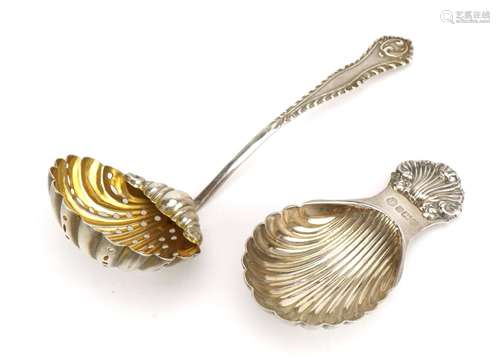 Edwardian silver tea strainer with gilt interior and an Eliz...