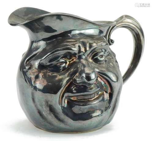 Manner of Burmantofts, silver plated jug with two faces, 23c...