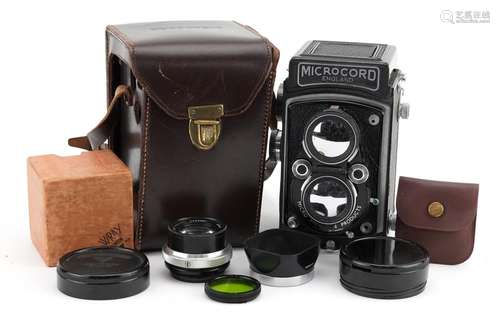 Microcord camera with leather case and Rollei lens cover and...