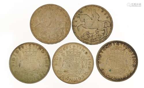 Five George V and George VI crowns comprising three 1935 Roc...