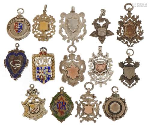 Fourteen Edwardian and later fobs, some with enamel includin...