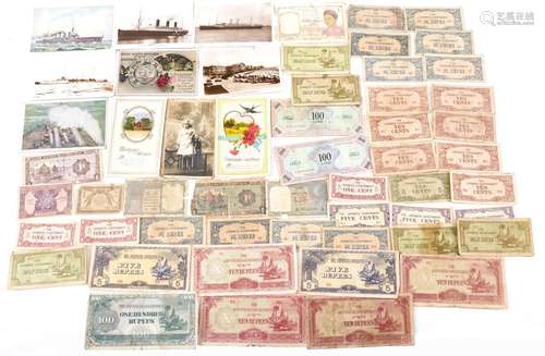 Collection of world banknotes and various postcards includin...