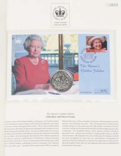 The Queens Golden Jubilee coin covers arranged in two albums...