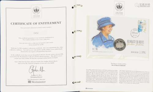 The Queens Golden Jubilee coin covers arranged in two albums...