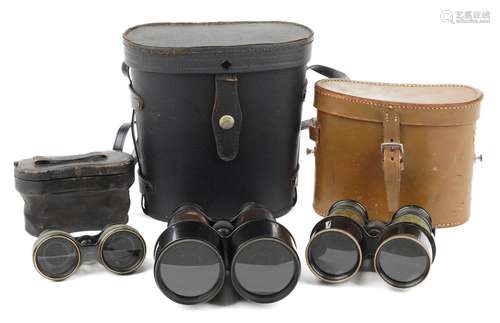 Three pairs of vintage binoculars with cases including marin...