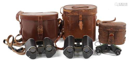 Three pairs of vintage binoculars with cases including two p...