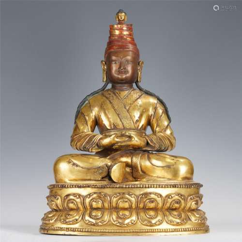 A TIBETAN GILT BRONZE FIGURE OF MASTER