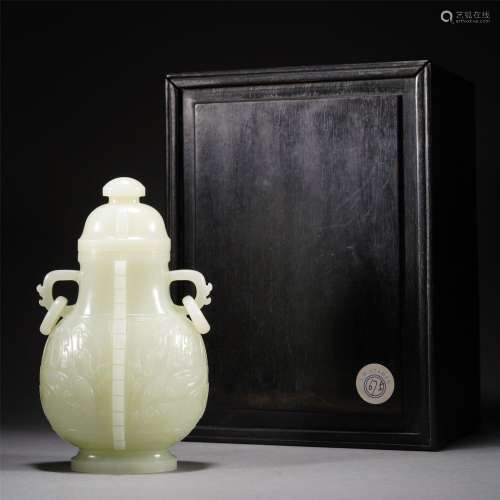 A CARVED JADE VASE WITH COVER