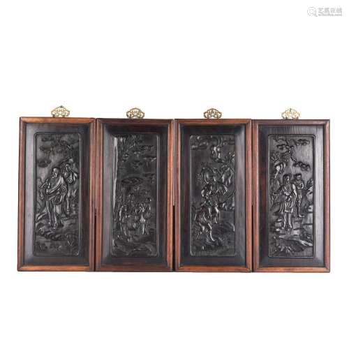 A GROUP OF FOUR CARVED WOOD HANGING PANELS