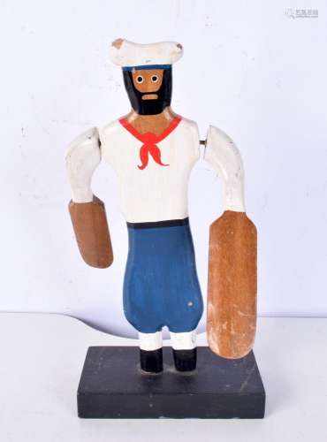 An antique wooden whirligig sailor 30 cm
