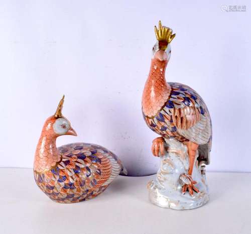 A large pair of imari porcelain birds, one formed stood upon...